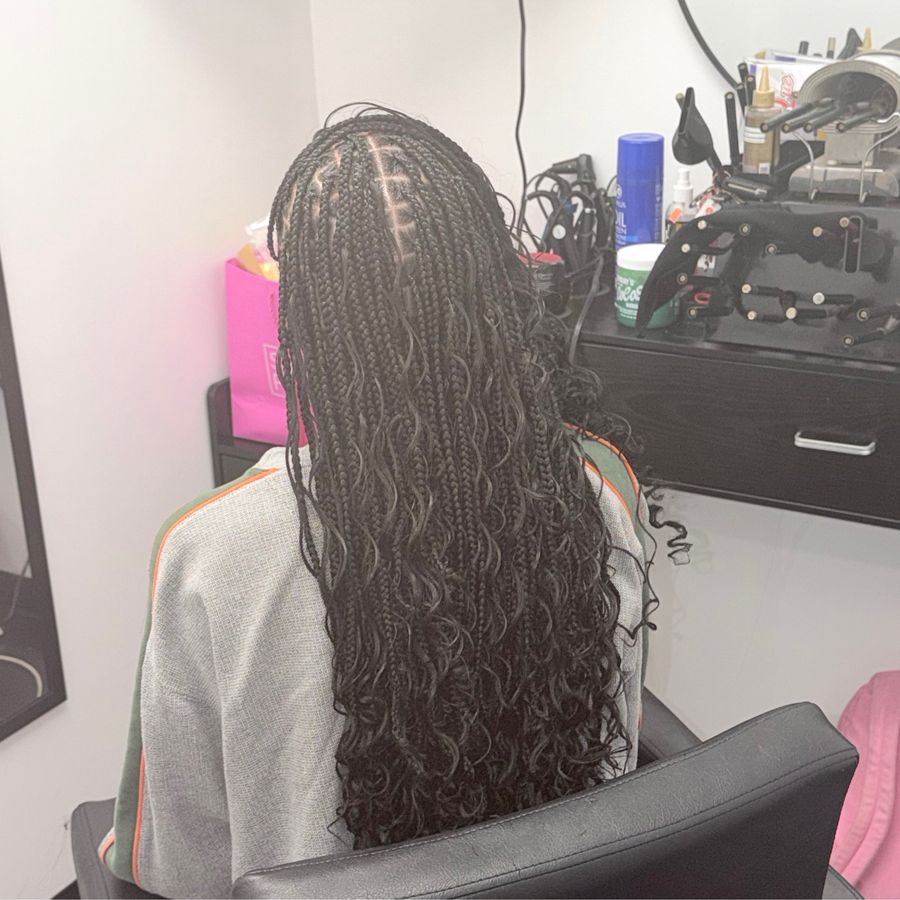 Boho knotless braids finished at her station.